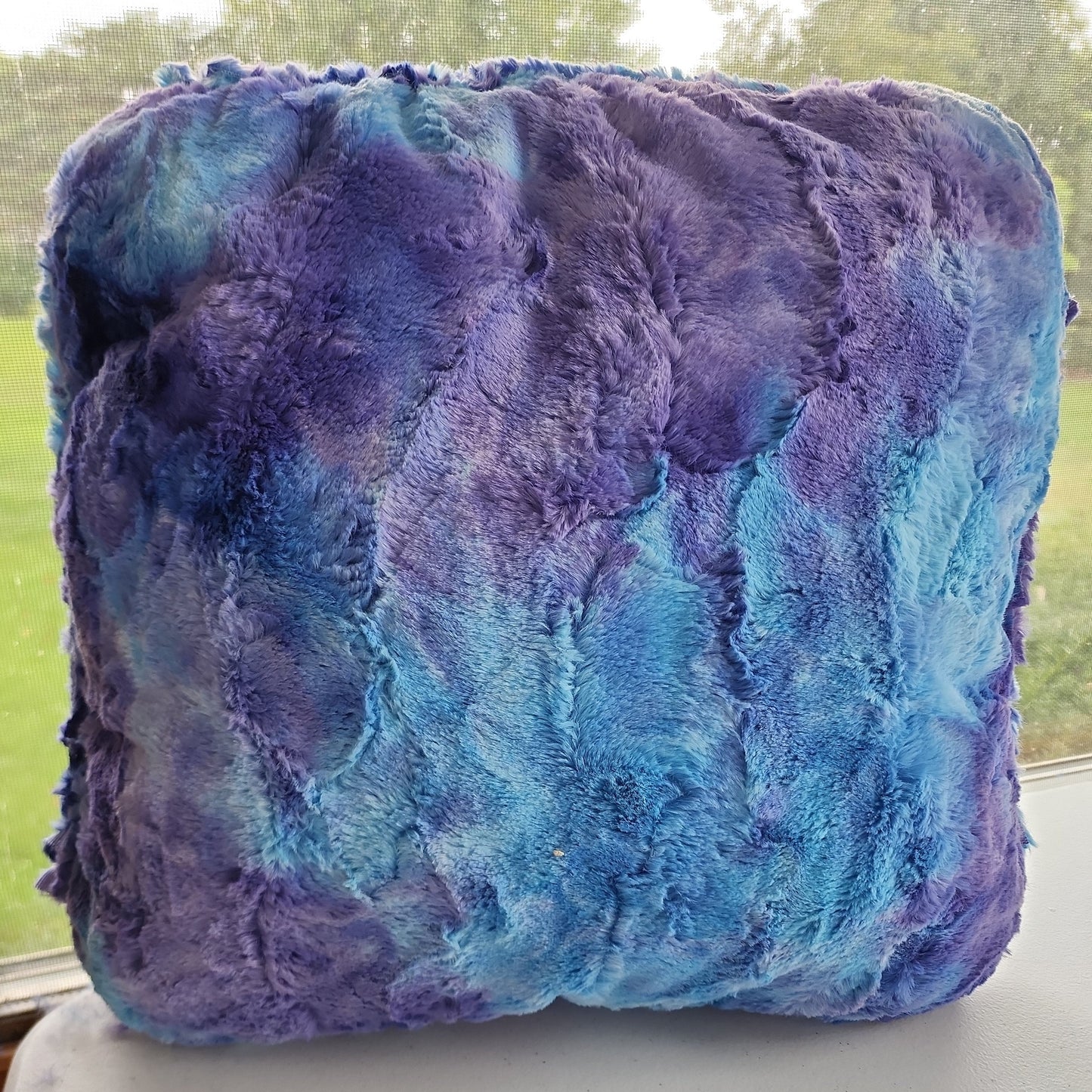 Love sleeping under the moonlight? How about resting your head on it's radiant beam? Our Moonbeam pillow is an 18"x18" soft yet firm pillow that has a calming blue/purple minky fabric handbraid around it.   These are MADE TO ORDER with a 1-2 week turnaround time. If the fabric inunavailable, we will reach out via email to let you know an availabiliy date and/or offer a refund. Please be patient as we try our best to fulfill your orders.